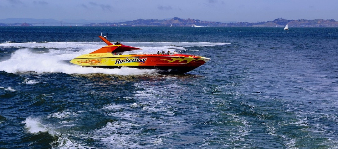 Which of the following forces act on the moving speedboat? The speedboat is driving forwards.