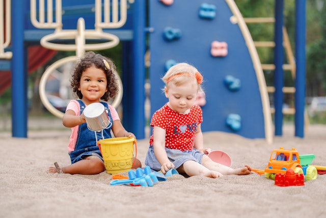 Children playing with toys around 3 years ago.