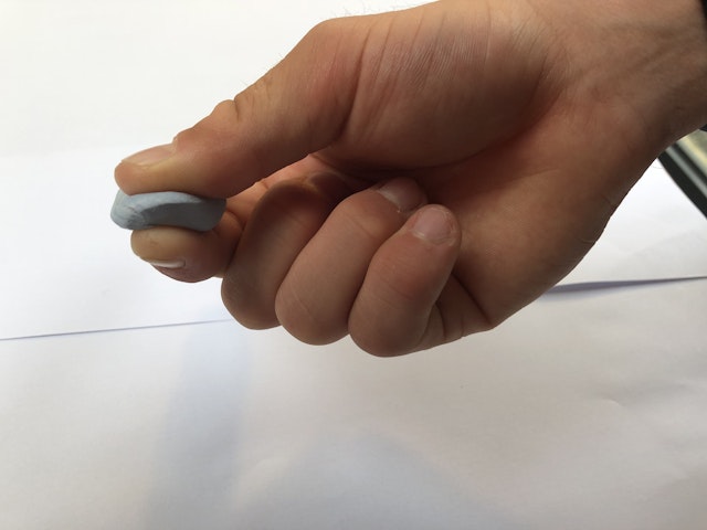 squeezing blu-tack between finger and thumb