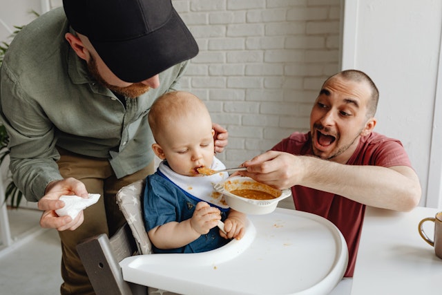 At what age do humans start eating foods other than milk?