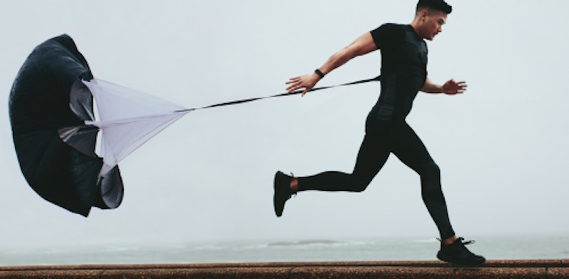 Why do runners sometimes use parachutes in training?