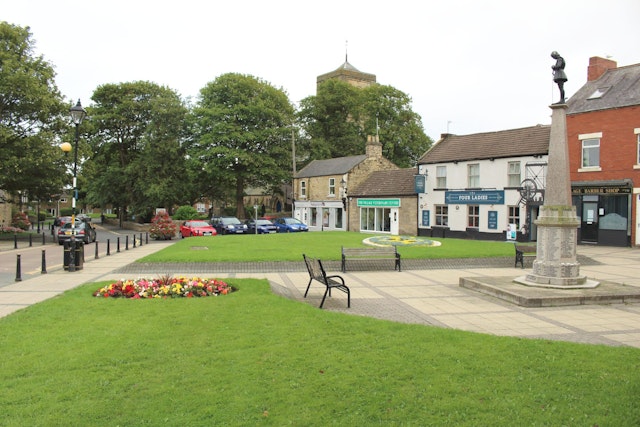 A few houses and shop and place of worship, and a small population. 